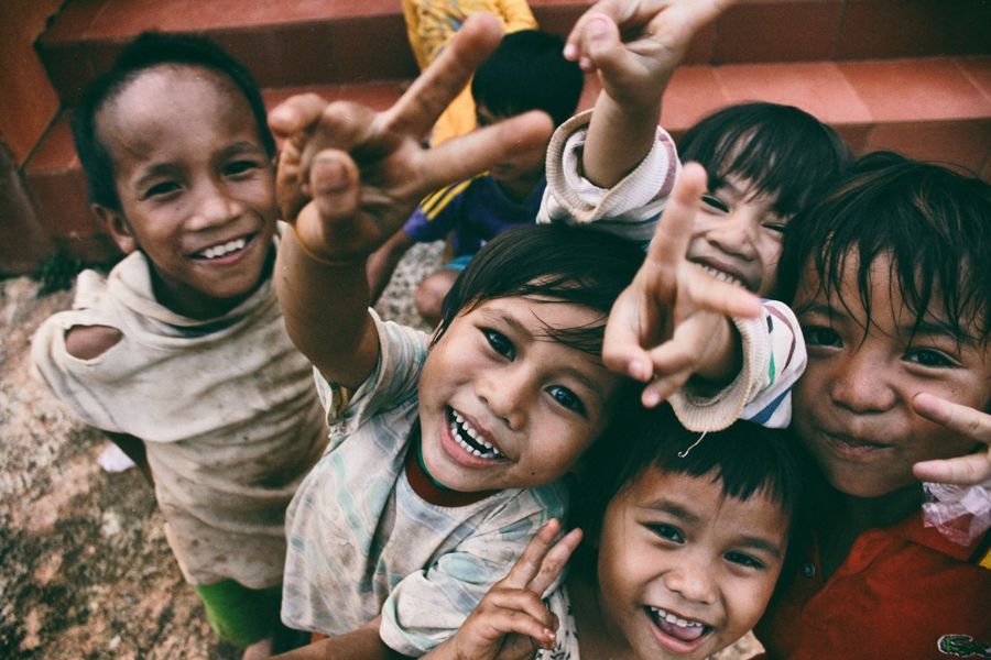 Children smiling at a Muslim Hands project